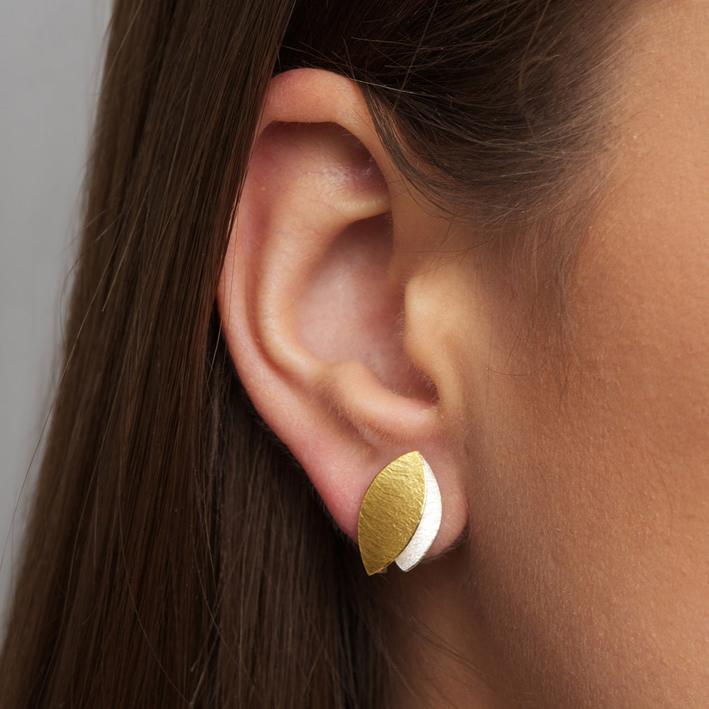 Photograph 2 of Manu's Contemporary Sterling Silver 22k Yellow Gold Textured Leaf Stud Earrings. Available on DESIGNYARD.com and in our Jewellery Shop Dublin, Ireland. Free Worldwide Shipping with DHL.