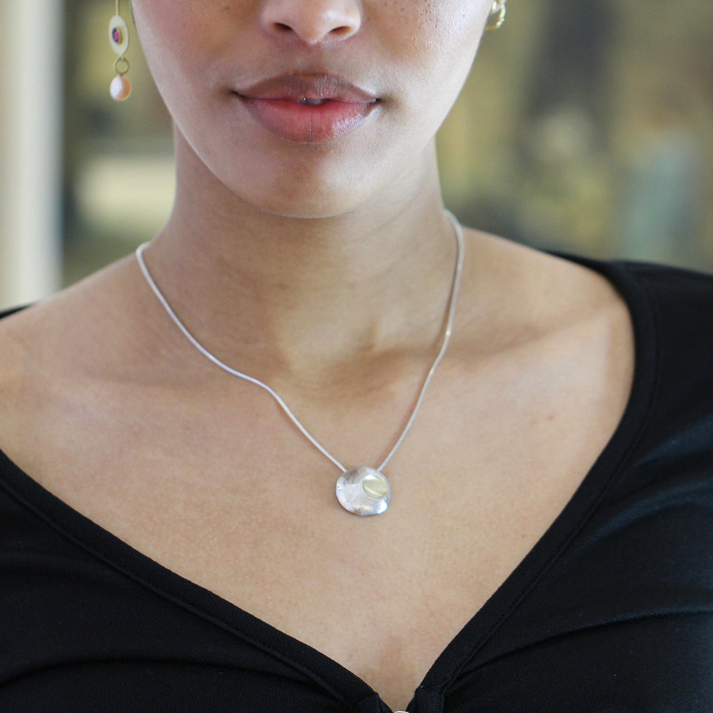 Photograph 3 of Martina Hamilton's Contemporary Sterling Silver Moon Shell Pendant. Available on DESIGNYARD.com and in our Jewellery Shop Dublin, Ireland.