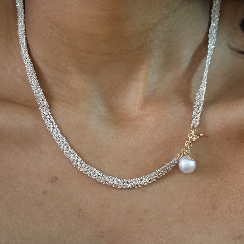 Photograph 3 of Myriam Oude Vrielink's Sterling Silver 14k Yellow Gold Pearl Ribbon Necklace. Available on  DESIGNYARD.com and in our Contemporary Jewellery Shop Dublin, Ireland. #1 for Contemporary Jewellery.