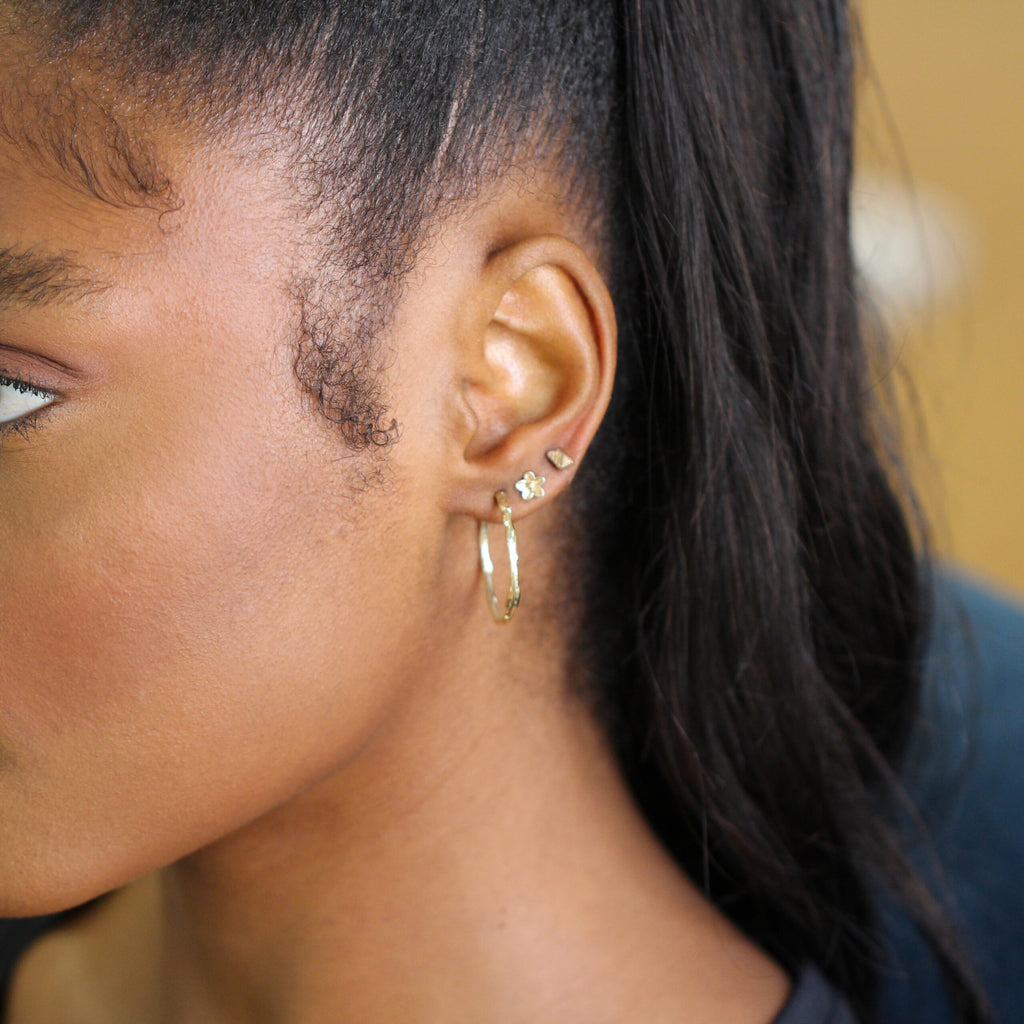 Photograph 3 of Neeltje Huddleston Slater's 14k Yellow Gold Large Branch Hoop Earrings. Available on DESIGNYARD.com and in our Contemporary Jewellery Shop Dublin, Ireland. #1 for Contemporary Jewellery.