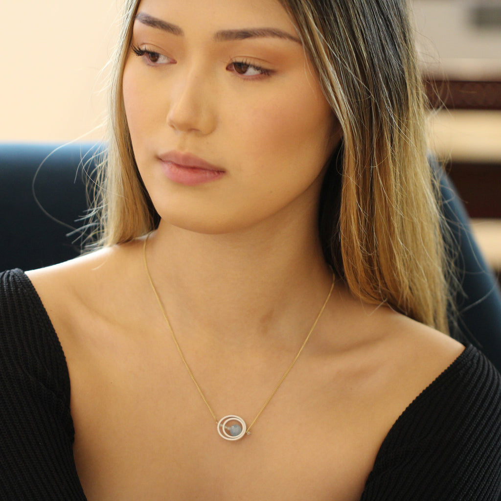 Photograph 2 of Nicole Van Der Wolf's Contemporary Yellow Gold Silver Aquamarine Ice Rink Double Axle Necklace. Available on DESIGNYARD.com and in our Jewellery Shop Dublin, Ireland. Free Worldwide Shipping with DHL.