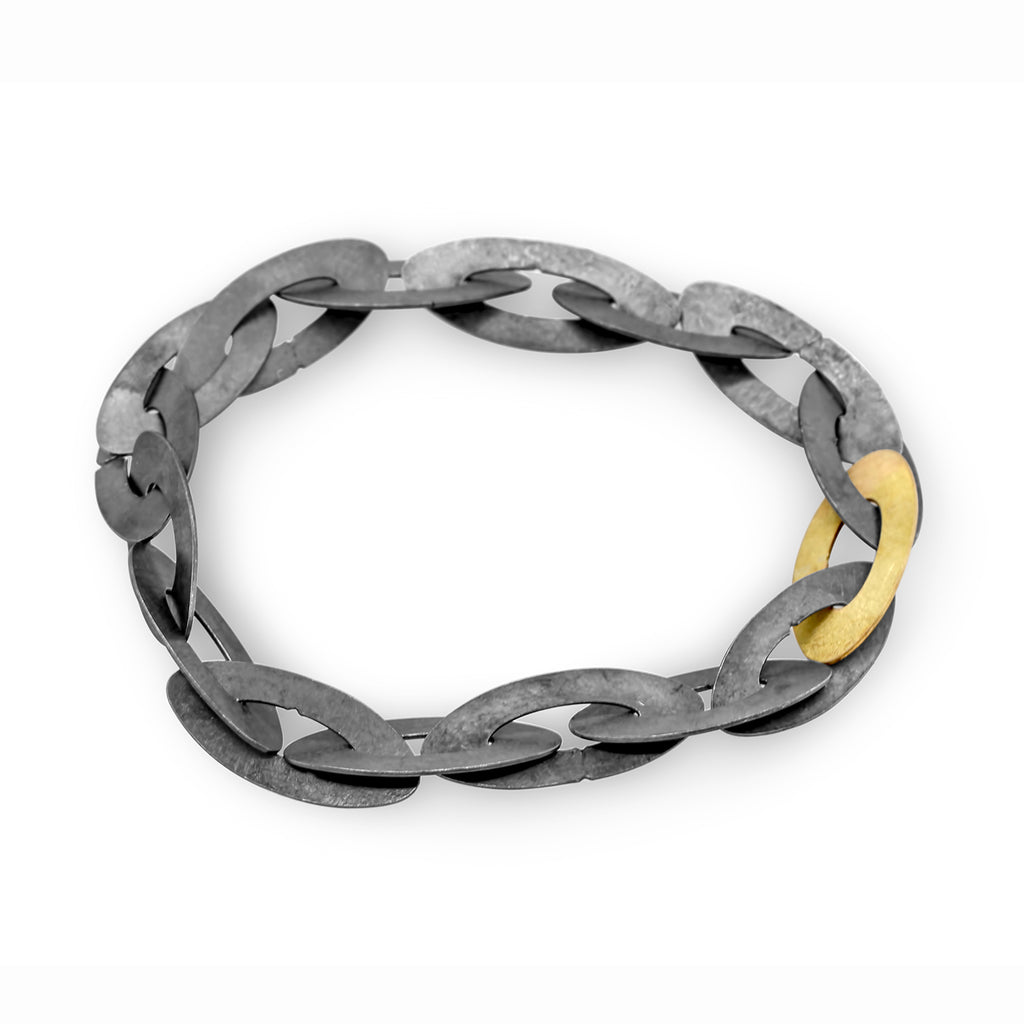 Photograph 1 of Nicole Van Der Wolf's Contemporary Oxidised Silver 18k Yellow Gold ShipShape Statement Bracelet. Available on DESIGNYARD.com and in our Jewellery Shop Dublin, Ireland. Free Worldwide Shipping with DHL.