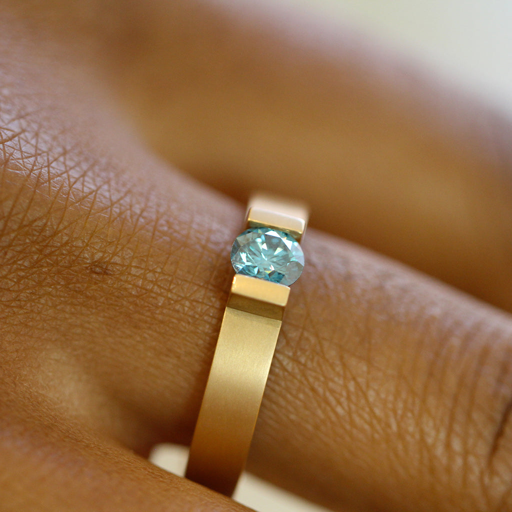 Photograph 2 of Niessing's Contemporary 18k Fine Rose Gold Spannring® Highend C Ocean Blue Diamond Engagement Ring. Available on DESIGNYARD.com and in our Jewellery Shop Dublin, Ireland. Free Worldwide Shipping with DHL.
