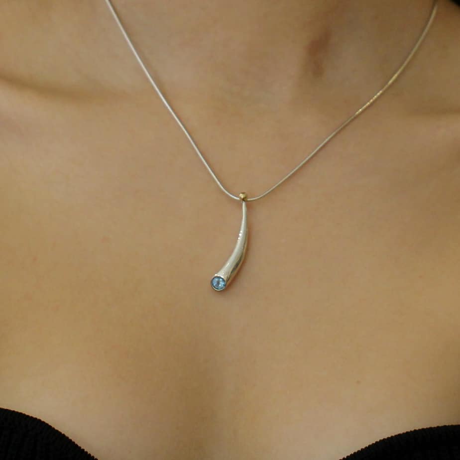 Photograph 2 of Paul Finch's Contemporary Sterling Silver 18k Yellow Gold Blue Topaz Statement Necklace. Available on DESIGNYARD.com and in our Jewellery Shop Dublin, Ireland. Free Worldwide Shipping with DHL.