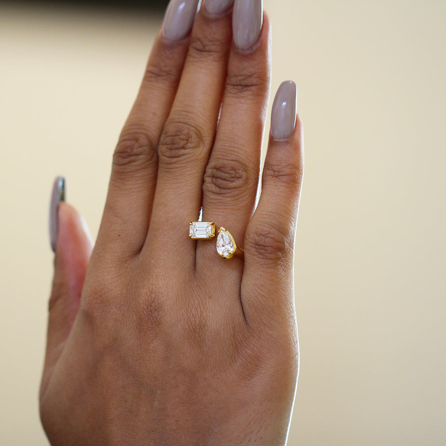 Model wears pear and emerald cut diamond Toi et Moi ring by ronan campbell at designyard contemporary jewellery gallery dublin ireland
