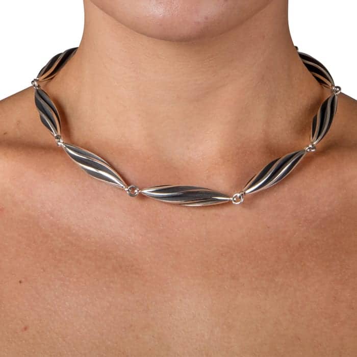 Photograph 2 of Sarah Herriot's Contemporary Oxidised Silver Beat Twist Statement Neck Piece. Available on DESIGNYARD.com and in our Jewellery Shop Dublin, Ireland. Free Worldwide Shipping with DHL.