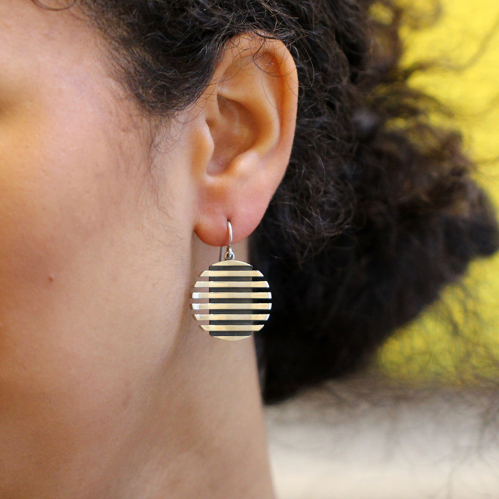 Photograph 2 of Sarah Herriot's Contemporary Oxidised Silver Escalator Hook Statement Earrings. Available on DESIGNYARD.com and in our Jewellery Shop Dublin, Ireland. Free Worldwide Shipping with DHL.