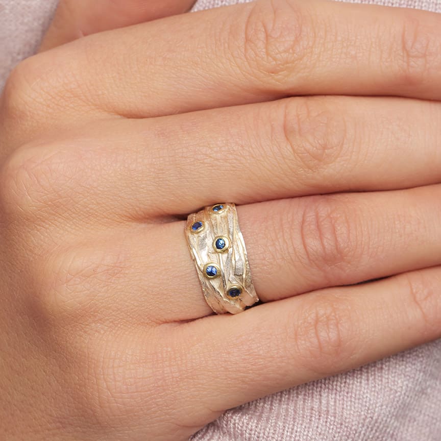 Photograph 2 of Shimara Carlow's Organic Sterling Silver & 18k Yellow Gold Blue Sapphire Wrap Ring. Available on DESIGNYARD.com and in our Jewellery Shop Dublin, Ireland. Free Worldwide Shipping with DHL.