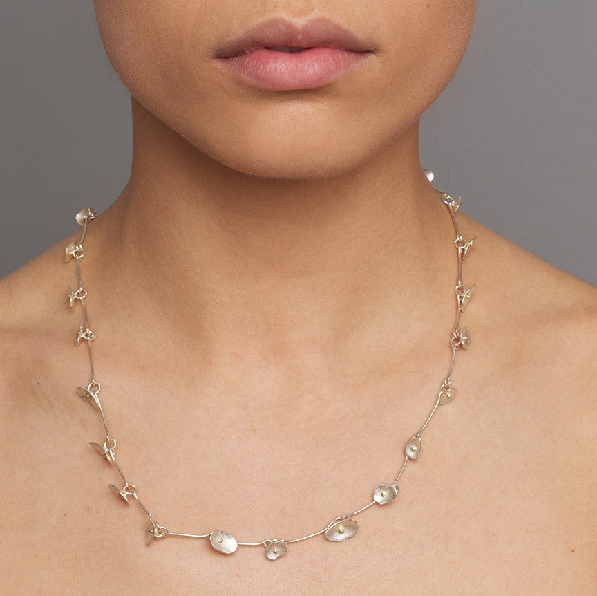 Photograph 2 of Shimara Carlow's Contemporary Silver & 18k Yellow Gold Honesty Necklace. Available on
 DESIGNYARD.com and in our Jewellery Shop Dublin, Ireland. Free Worldwide Shipping with DHL.