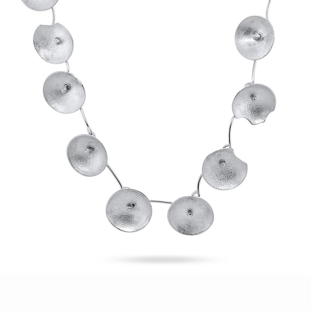 Photograph 1 of Shimara Carlow's Contemporary Sterling Silver Large Daisy Statement Necklace. Available on DESIGNYARD.com and in our Jewellery Shop Dublin, Ireland. Free Worldwide Shipping with DHL.