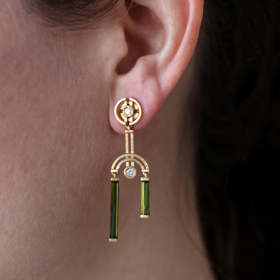 Photograph 2 of Shimell And Madden's Contemporary 18k Yellow Gold Green Tourmaline Arc Double Drop Earrings. Available on DESIGNYARD.com and in our Jewellery Shop Dublin, Ireland. Free Worldwide Shipping with DHL.