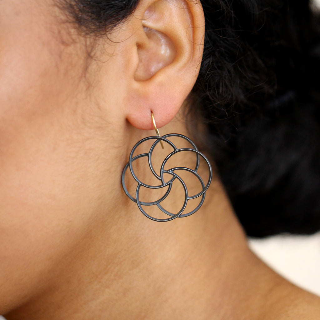 Photograph 3 of Sophia Epp's Contemporary Oxidised Silver 18k Yellow Gold Christmas Rose Statement Earrings. Available on DESIGNYARD.com and in our Jewellery Shop Dublin, Ireland. Free Worldwide Shipping with DHL.