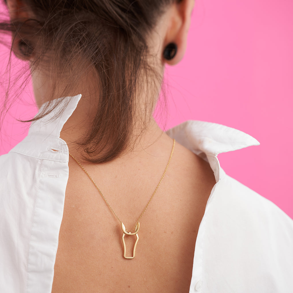 Photograph 2 of Vanessa Ree's Contemporary 18k Yellow Gold Irish Horse Pendant. Available on DESIGNYARD.com and in our Jewellery Shop Dublin, Ireland. Free Worldwide Shipping with DHL.