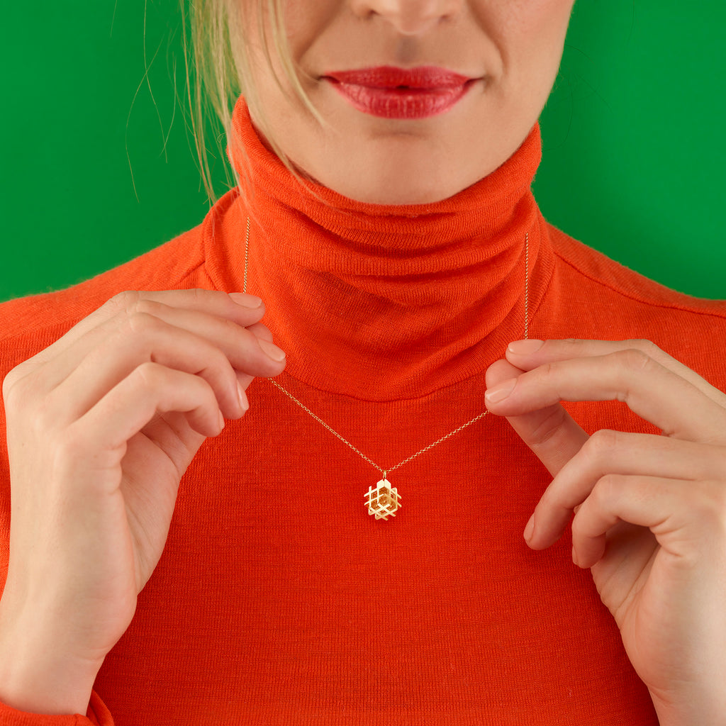 Photograph 2 of Vanessa Ree's Contemporary 18k Yellow Gold 3D# Positive Pendant. Available on DESIGNYARD.com Number 1 for Contemporary Jewellery Dublin, Ireland. Free Worldwide Shipping with DHL.