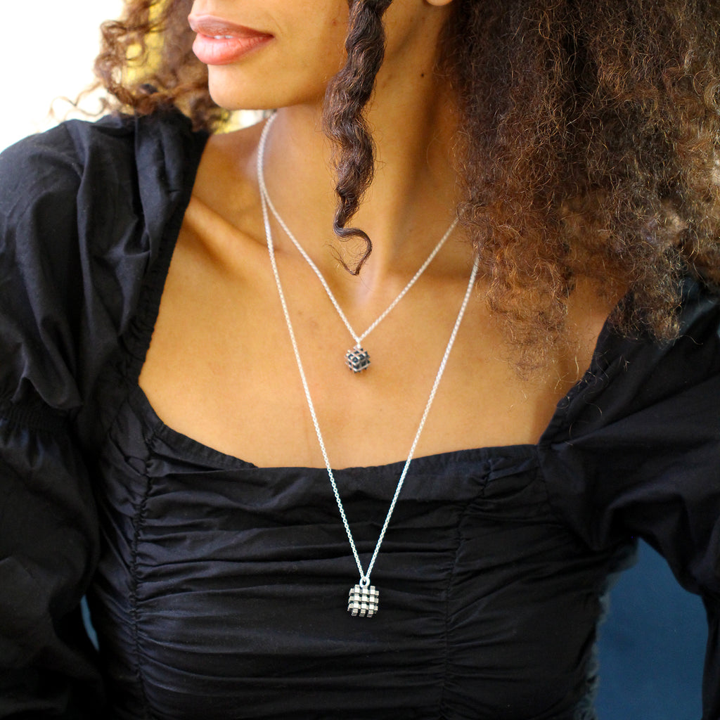 Photograph 3 of Vanessa Ree's Contemporary Sterling Silver Oxi 3D# Positive Small Pendant. Available on DESIGNYARD.com Number 1 for Contemporary Jewellery Dublin, Ireland. Free Worldwide Shipping with DHL.