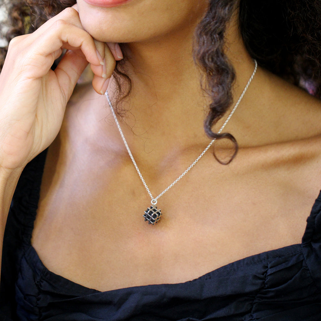 Photograph 4 of Vanessa Ree's Contemporary Sterling Silver Oxi 3D# Positive Small Pendant. Available on DESIGNYARD.com Number 1 for Contemporary Jewellery Dublin, Ireland. Free Worldwide Shipping with DHL.