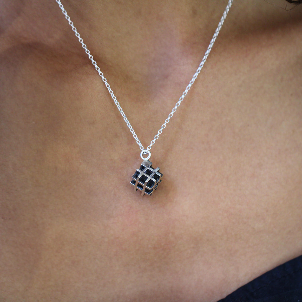 Photograph 2 of Vanessa Ree's Contemporary Sterling Silver Oxi 3D# Positive Small Pendant. Available on DESIGNYARD.com Number 1 for Contemporary Jewellery Dublin, Ireland. Free Worldwide Shipping with DHL.